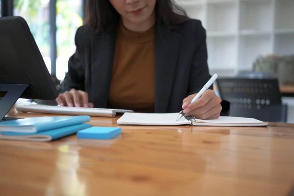 Accountant working through paperwork at a desk